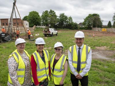 (L-R): Marie Lane, Chair of the Patient Participation Group; Cllr Jasbir Jaspal, Cabinet Member for Adults and Wellbeing, Tracy Dunne, Chair of the Rakegate Tenants and Residents Association, and Cllr Steve Evans, Deputy Leader and Cabinet Member for Housing, observe the start of the site investigation works at the Oxley site