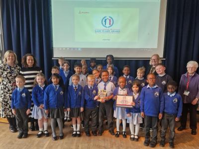 Staff and pupils celebrate the award