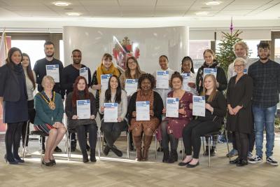 Mayor of Wolverhampton Councillor Claire Darke, seated, the City of Wolverhampton Council's Principal Social Worker Louise Haughton, left, and Alison Hinds, Head of Children and Young People in Care, front right, with many of the social workers who have completed their Assessed Year in Employment