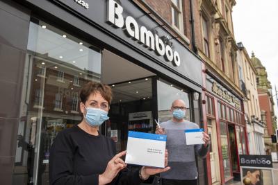 Staff at Bamboo Hair are among those having a regular rapid Covid-19 test. Pictured are Director Adriana Francis and Manager Stephen Hollings with home test kits