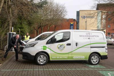 Councillor Steve Evans, City of Wolverhampton Council's cabinet member for city environment and climate change, with council parking attendant Jaswant Bhambra and the new all-electric vans