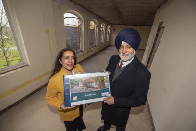 Councillor Jasbir Jaspal, Cabinet Member for Public Health and Wellbeing and Councillor Bhupinder Gakhal, Cabinet Member for City Assets and Housing at Bond House, with an artist’s impression of how the completed building will look