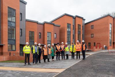 Members of City of Wolverhampton Council’s housing team and Equans in front of the new council homes at Hobgate Road, Heath Town