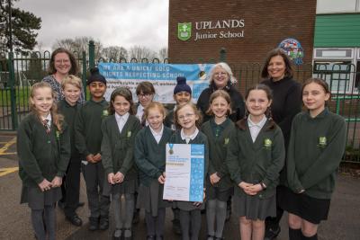Celebrating their Gold UNICEF Rights Respecting Schools status are Uplands Junior School pupils with, back, left to right, Sarah Lane, Rights Respecting Schools Award Coordinator, Brenda Wile, the City of Wolverhampton Council's Deputy Director of Education, and Suzanne Webster-Smith, Headteacher