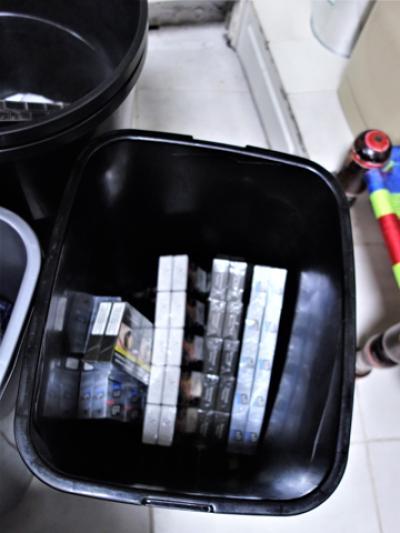 Illicit cigarettes hidden inside a bin