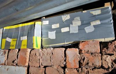 Boxes of illicit cigarettes and tobacco hidden within brick walls