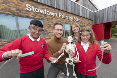 Pupils Abhinav Singh and Ruby Bolton celebrate Stowlawn Primary School receiving the Primary Science Quality Mark with Councillor Chris Burden, the City of Wolverhampton Council's Cabinet Member for Children, Young People and Education and the school's Science Lead Sarah Bedworth