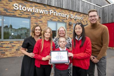 Stowlawn Primary School has been named a School of Sanctuary. Celebrating are pupils with, left to right, Stacey Whitehouse, the school's Assistant Headteacher and Inclusion Lead, and Claire Sumner, the City of Wolverhampton Council's City of Sanctuary Lead, and Councillor Chris Burden, Cabinet Member for Children, Young People and Education