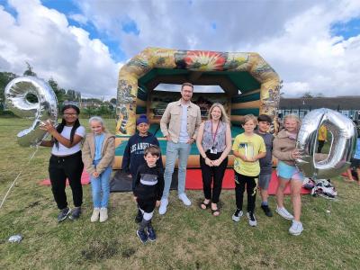 Pupils join Councillor Chris Burden, Cabinet Member for Children, Young People and Education, and headteacher Lisa Rogers to celebrate Villiers Primary School's 90th birthday