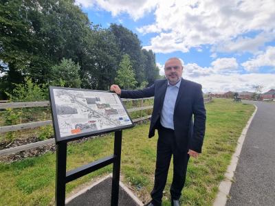 Councillor Craig Collingswood, cabinet member for environment and climate change with one of the new information boards at Ward Street