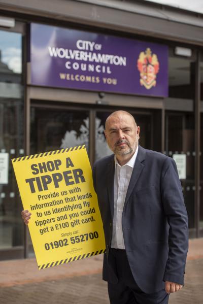 Councillor Craig Collingswood, cabinet member for environment and climate change at City of Wolverhampton Council, with contact details for the Shop a Tipper scheme