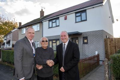 Wolverhampton Homes Director of Property Services, Ian Gardner (left), and City of Wolverhampton Council Deputy Leader and Cabinet Member for Housing, Councillor Steve Evans (right), with D’Urberville Road resident, Mickey Luck
