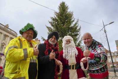 Father Christmas joins, left to right, Brian Hall, Street Lighting Operative, Councillor Bhupinder Gakhal, Cabinet Member for Visitor City and Dicky Dodd as Wolverhampton prepares to celebrate the start of the festive season