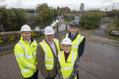 (L-R): Mark Birks, Principal and Head of Residential Birmingham at Avison Young, Councillor Stephen Simkins, City of Wolverhampton Council Leader, Cheryl Blount-Powell, National Property Development Manager at the Canal & River Trust, and James Dickens, Managing Director of Wavensmere Homes, with the Canalside South site to the right
