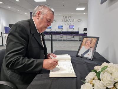 Signing the Book of Condolence at the Civic Centre is Leader of the City of Wolverhampton Council, Councillor Ian Brookfield