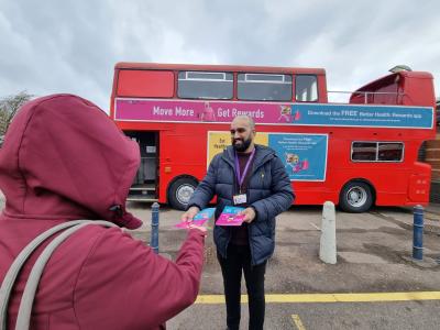 City of Wolverhampton Council Public Health & Wellbeing Engagement Officer Amrik Sangha meets a member of the public at the Better Health: Rewards Bus which will be at the Civic Centre and West Park this week