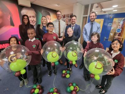 Pupils from Woodthorne Primary School celebrate their Good Ofsted rating with Anum Arshad, Geography Lead, Sophie Jones, Deputy Headteacher, Councillor Chris Burden, Cabinet Member for Education, Skills and Work, Tom Hinkley, Headteacher and Tom Johnston, Maths and Curriculum Lead