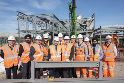 Wolverhampton Interchange partners and apprentices sign one of the steels to be used in the construction of the new railway station building