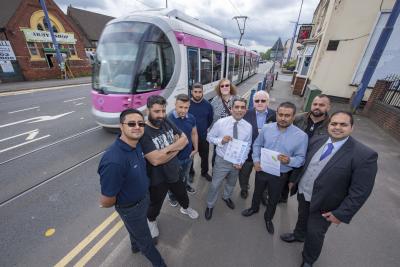 (l-r) Bilston Road Action Group (BRAG) Members Amo Singh, NES Wolesalers, Jag Singh, Wilson Wholesalers, Ian Alici, Jeans Cafe, and Amardeep Singh, NES Wholesalers, with Cllr Anwen Muston, Cllr Paul Singh, Cllr Keith Inston, Rakesh Ladher, Red Lion Landlord and BRAG Secretary, Sunil Kanda, tintcenters.com and BRAG member, and Cllr Harman Banger