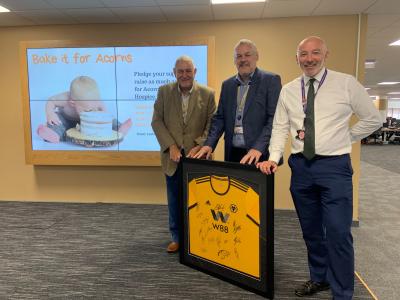 Councillor Peter Bilson, Deputy Leader for City of Wolverhampton Council, Councillor Ian Brookfield, Leader of the Council and Tim Johnson Managing Director of the City Council with the signed Wolves shirt donated by Wolves FC
