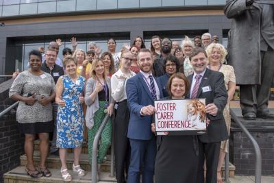 Front right-left, Councillor John Reynolds, Cabinet Member for Children and Young People, Emma Bennett, Director of Children’s Services, and Sean McBurney, WV Active Manager, supported by foster carers and members of the Fostering for Wolverhampton team