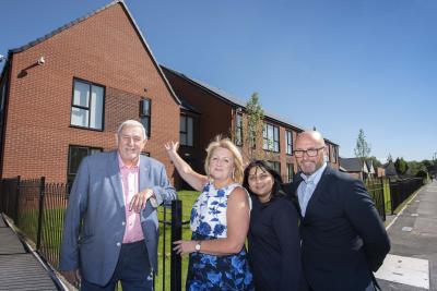 (l-r): Cllr Peter Bilson, Cllr Linda Leach, Wolverhampton Homes Tenancy Officer, Susan Sharma, and Regional Director of Galliford Try Partnerships, Darren Beale, outside the new supported living units
