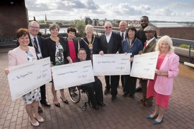 Former Mayor Councillor Phil Page (centre) presents cheques to representatives from his chosen charities with the current Mayor of Wolverhampton, Councillor Claire Darke, the Mayor’s Consort, Dr Paul Darke and Deputy Mayor of Wolverhampton Councillor Greg Brackenridge
