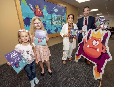 Left, Cleo Lovatt, who was commended for her creation, Freezy, and Evie Clarke, who helped inspire the character of Lord Fever, with the City of Wolverhampton Council's Cabinet Member for Public Health and Wellbeing Councillor Jasbir Jaspal and Wolverhampton's Director of Public Health, John Denley