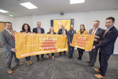 Members of the City of Wolverhampton Council's Strategic Executive Board, including centre, Chief Executive Tim Johnson, are supporting the Orange Wolverhampton campaign to end inter-personal violence