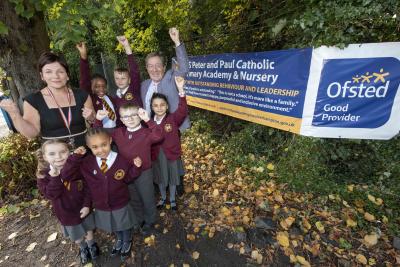 Headteacher Jenny Byrne, Cabinet Member for Education and Skills Councillor Dr Michael Hardacre and pupils celebrate SS Peter and Paul Catholic Primary Academy’s Good rating last year