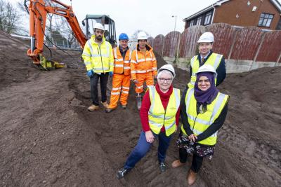 Front (l-r) local Councillors Lynne Moran and Obaida Ahmed join Director of Public Health John Denley at the site of the former subway which is being filled in. Behind them are back, (l-r), Amjid Mehmood, New Works, from the City of Wolverhampton Council and Paul Edwards, Project Manager, and Les Pitcher, Site Manager, from contractors Barhale