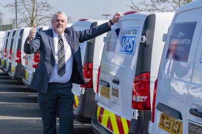 Leader of City of Wolverhampton Council, Councillor Ian Brookfield, with the fleet of vans which will deliver food parcels to the city’s most vulnerable residents