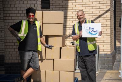 Alex Dixon from the City of Wolverhampton Council and Mark Williams from The Well with some of the food parcels