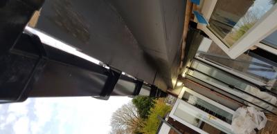 Gap in the guttering which ran alongside the extension