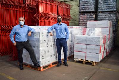 (l-r): SCP Group’s Ranjit Dale, Managing Director, and Rikki Dale, Finance Director, with 10 tonnes of PPE equipment ready to be sent to New Cross Hospital Wolverhampton. Image courtesy of Rachel Robinson – Community and Events Fundraiser, Royal Wolverhampton NHS Trust