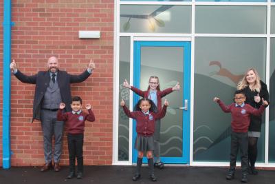 Pupils celebrate with Spring Vale Primary School Headteacher Chris Blunt and Deputy Headteacher Katie Manning