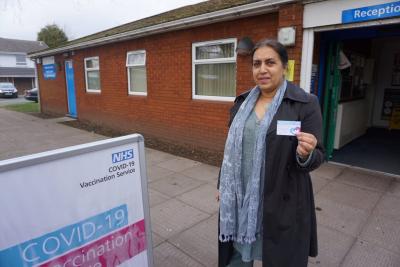 Councillor Jasbir Jaspal, Cabinet Member for Public Health and Wellbeing, is imploring people to get the life-saving Covid-19 vaccine after seeing people close to her tragically pass away with the virus. She is pictured with the card on which patients can record the type and date of vaccine they have had