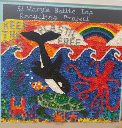 The mural created by pupils at St Mary's Catholic Primary Academy out of old bottle tops