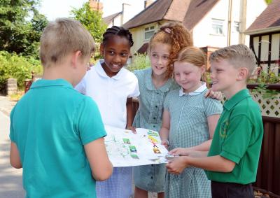 Fallings Park Primary School pupils Caleb Blakemore, Rochee Gordon, Layla Brain, Taylor-Sky Westwood and George Rowton check out their next stop on the Beat the Street map