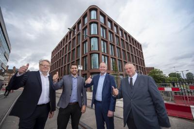 Ion Development Director, Rob Mason, Senior Architect at Glenn Howells Architects, Fraser Godfrey, GRAHAM Regional Director, Ronan Hughes, and City of Wolverhampton Council Deputy Leader and Cabinet Member for City Economy, Cllr Stephen Simkins, in front of the completed i9 development