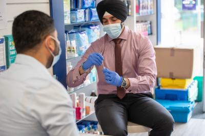 Jagdeep Gill, Pharmacist at Ettingshall Pharmacy, completing a rapid Covid-19 test