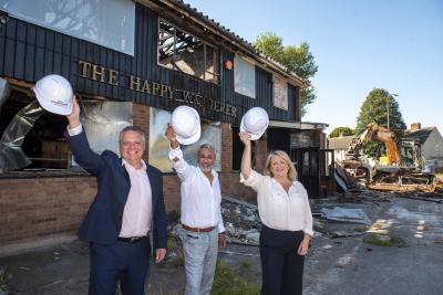 City of Wolverhampton Council Deputy Chief Executive, Mark Taylor, property owner Kam Sanghera, and Cllr Linda Leach (Bilston North) celebrate demolition work starting on the former Happy Wanderer pub in Green Lanes