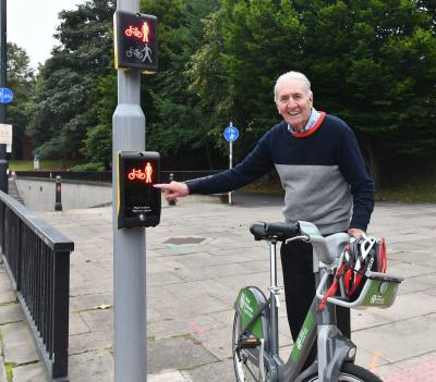 City Cycling Ambassador Hugh Porter MBE inspects the new traffic lights that will help users of the new ring road cycle path to safely cross over the busy Waterloo Road junction