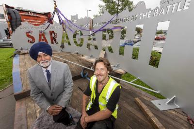 Councillor Bhupinder Gakhal, City of Wolverhampton Council’s Cabinet Member for City Assets and Housing with sculptor Luke Perry preparing to install the back plate for the Saragarhi Monument