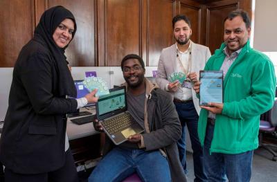 (L-R): Cllr Obaida Ahmed, Cabinet Member for Digital City, Jonathan Brown, city resident, Cllr Qaiser Azeem, Digital Innovation Champion, and Bashir Ahmed, City Manager at CityFibre promoting WV Online at Wolverhampton Central Library during Get Online Week