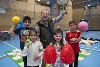 Enjoying half term fun at Aldersley Leisure Village are, back row, (l-r), Harjas Thind and Councillor Mike Hardacre, Cabinet Member for Education and Skills, and front row, left to right, Rubani Thind, Amelia Price and Daniel Welsh