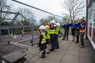 Councillor Dr Michael Hardacre, Cabinet Member for Education, Skills and Work, joins staff and pupils to inspect work on the extension at St Bartholomew's CE Primary School recently