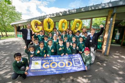 Back row, l-r, Councillor Chris Burden, Cabinet Member for Education, Skills and Work, Rachel Purshouse, Deputy Headteacher, and Jo Hemmings, Headteacher, celebrate a Good Ofsted report with Goldthorn Park Primary School pupils