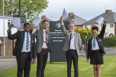 Left to right, celebrating New Academy's Good Ofsted are Year 11 student Mario Chibuike, Councillor Chris Burden, Cabinet Member for Education, Skills and Work, Craig Cooling, Principal, and Year 10 student Madison Cox