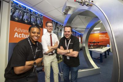 (L-R): Collins Aerospace UK Heat Operative apprentice, Tianna Smalling, City of Wolverhampton Council Cabinet Member for Education, Skills and Work, Councillor Chris Burden, and Collins Aerospace UK Early Careers Lead, Wolverhampton, Actuation Systems, Oliver Herrmann, at Collins Aerospace UK in Wolverhampton